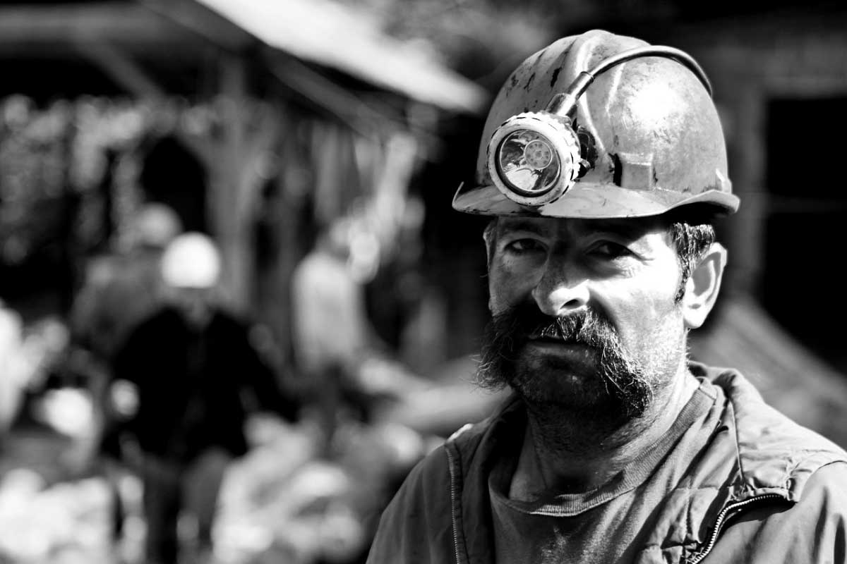 coal miner wearing helmet
